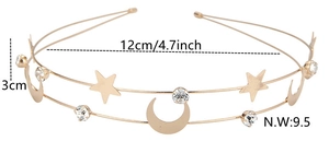 Detail view of golden double-layer headband with stars, moon elements and clear crystals