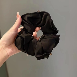 Elegant black satin scrunchie with sparkling silver rhinestones for ponytail styling