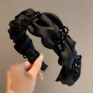 Elegant black satin pleated headband with sparkling black crystal beads and bow accent