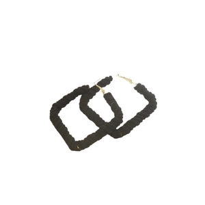 Fashionable black faux fur rectangular hoop earrings with gold metal hooks on white backdrop