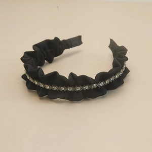 Elegant black velvet padded headband with sparkling crystals for a vintage hair accessory look