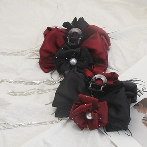 Elegant floral claw clip with black pearls and long tassels for women's hair styling