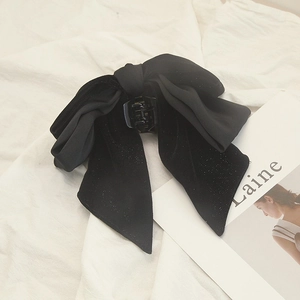 Elegant black velvet bow hair claw clip with shimmering glitter for women's hair