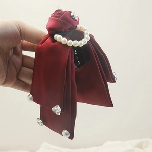 Elegant wine red satin hair claw clip with a rose flower, pearls and bow ribbons