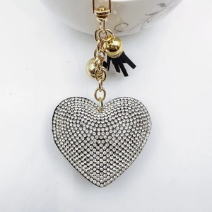 Sparkling diamond heart keychain with elegant black tassel and gold lobster clasp