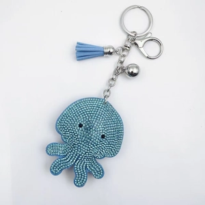 Sparkling light blue octopus keychain with crystal rhinestones, tassels and a small bell