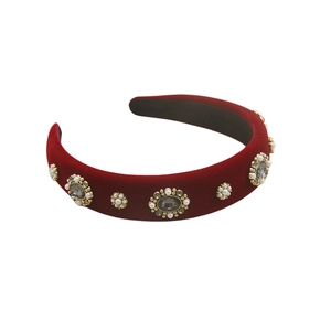 Detail of red velvet headband with baroque pearls and luxury gemstone floral embroidery