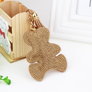 Sparkling crystal bear keychain with gold tassel and rhinestone details for handbag charm