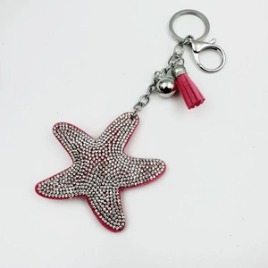 Starfish keychain with sparkling rhinestones, pink velvet tassels and silver bell charm