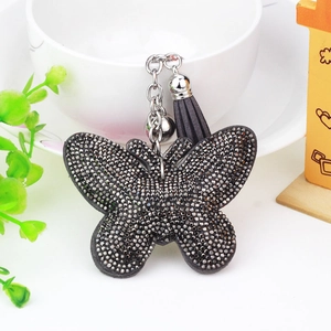 Velvet butterfly keychain with sparkling grey rhinestones, silver bell, and leather tassel