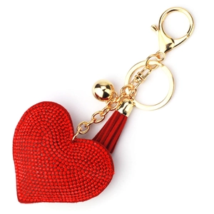 Detail of red heart keychain with crystals, leather tassel and golden bell hardware