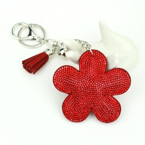 Sparkling red rhinestone flower keychain with matching fringe and silver metal accessories