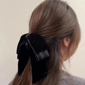 Elegant black velvet bow hair claw clip for women featuring subtle shimmer and vintage style
