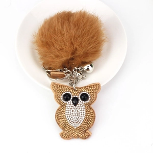 Creative owl keychain with fluffy brown faux fur pom pom and sparkly rhinestones