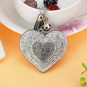 Sparkling heart rhinestone keychain with gray leather tassel and bell on silver chain