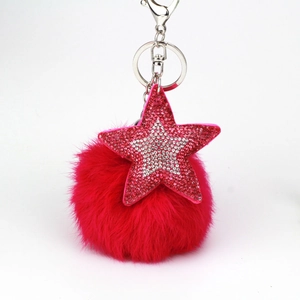 Porte-clés étoile avec strass roses, pompon en fausse fourrure et fermoir mousqueton