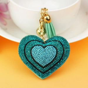Sparkling heart keychain with teal rhinestones, golden bell and matching tassel pendant