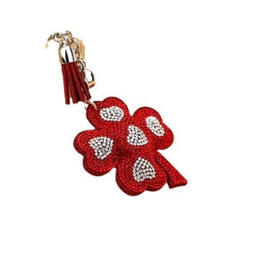 Red rhinestone four-leaf clover keychain with leather tassel and silver metal ring