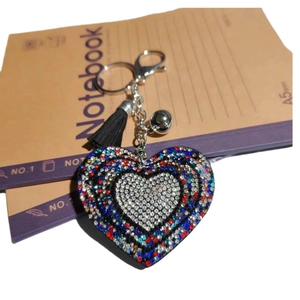 Sparkling heart keychain with colorful rhinestones, black tassel, and silver bell charm