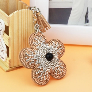 Porte-clés tournesol avec cristaux bicolores et pompon décoratif en cuir marron
