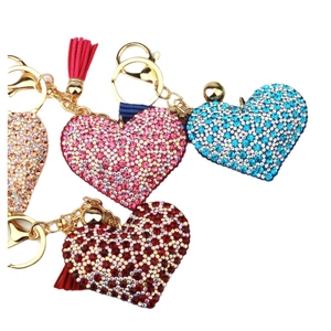 Sparkling rhinestone heart keychains with colorful leather tassels in diverse colors