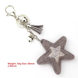 Detailed view of crystal star keychain with purple tassels showing 80mm size dimensions