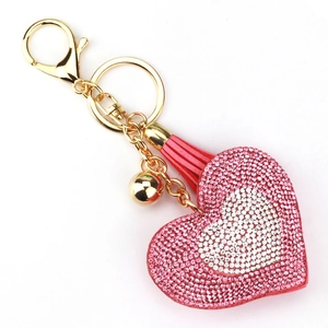 Portachiavi a cuore con strass rosa e bianchi, dettagli dorati e nappa in pelle