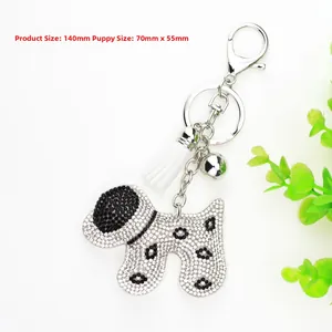 Detail showing dimension of crystal velvet dog keychain with tassel and bell charms