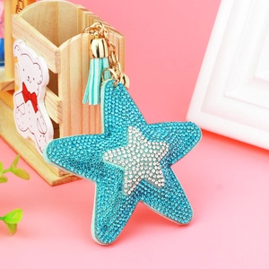 Sparkly star-shaped rhinestone keychain with blue tassels and golden metal ring