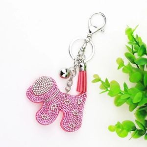 Pink rhinestone dog keychain with matching tassel and silver bell for handbag decoration