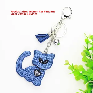 Close-up of blue rhinestone seated cat keychain with tassel and bell showing 160mm dimensions