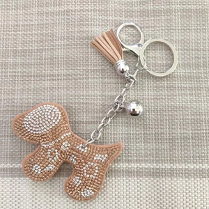 Sparkling rhinestone dog keychain with champagne crystals and stylish leather tassel charm