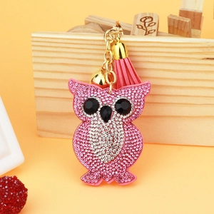 Detailed view of pink owl keychain with sparkling rhinestones and pink leather tassel