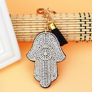 Detail of Hamsa Hand keychain with sparkling rhinestones and a black tassel charm