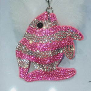 Sparkling pink rhinestone dolphin pendant keychain with soft white fur pom pom accessory