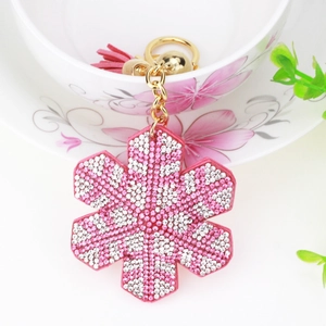 Sparkling pink snowflake keychain with rhinestone floral pendant and leather tassel