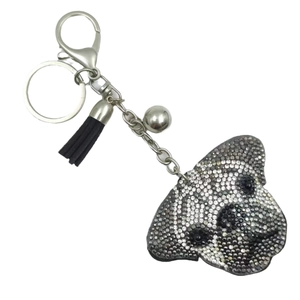 Porte-clés chien en strass noir et blanc avec pompon en cuir et clochette argentée élégante