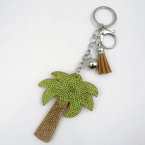 Sparkling palm tree keychain with green rhinestones, silver ring, and brown tassel charm