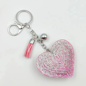 Porte-clés cœur rose avec strass brillants et pompon en cuir pour sacs de femmes