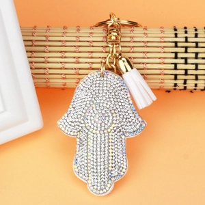 Detailed view of Hamsa Hand keychain with crystal rhinestones and white tassels charm