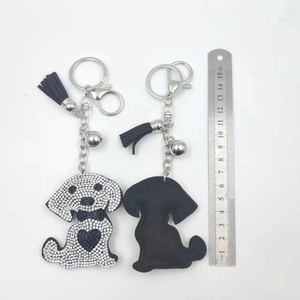 Sparkly rhinestone dog keychain with black tassel and silver metal clip, 15cm length