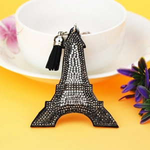 Close-up of black Eiffel Tower keychain with silver rhinestones and a black tassel