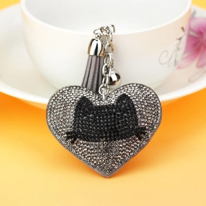 Sparkly heart keychain with cat silhouette rhinestones, silver bell and grey tassel detail