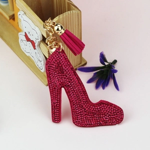 Sparkling rhinestone high heel keychain with velvet texture and tassel in rose red