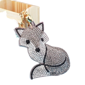 Sparkling fox keychain featuring white rhinestones and a golden metallic chain