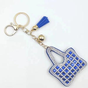 Creative mini handbag keychain with blue rhinestones, gold tassels, and lobster clasp
