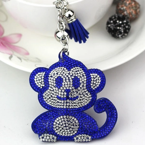 Cute blue monkey keychain with shiny rhinestones and tassel accessory for bags