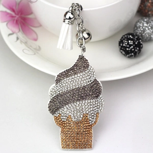 Macro shot of ice cream cone keychain with sparkling rhinestones and a soft white tassel