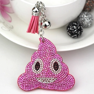 Sparkling pink emoji poop keychain with rhinestones, leather tassel and bell charm
