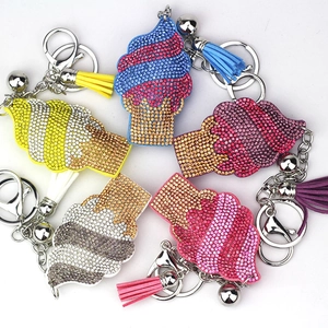 Detail of colorful rhinestone ice cream keychains with matching leather tassels